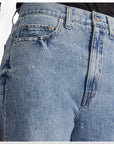 Close-up of Daze Denim Far Out High Rise Studded Jeans showcasing sparkling crystal details on classic blue denim fabric.