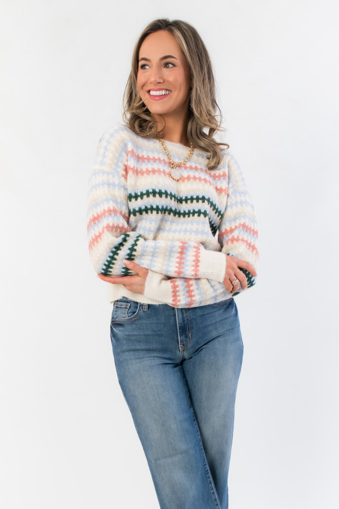 Mountain Top Stripe Knit Sweater featuring soft knit texture, colorful horizontal stripes, and relaxed fit ideal for cold weather layering.