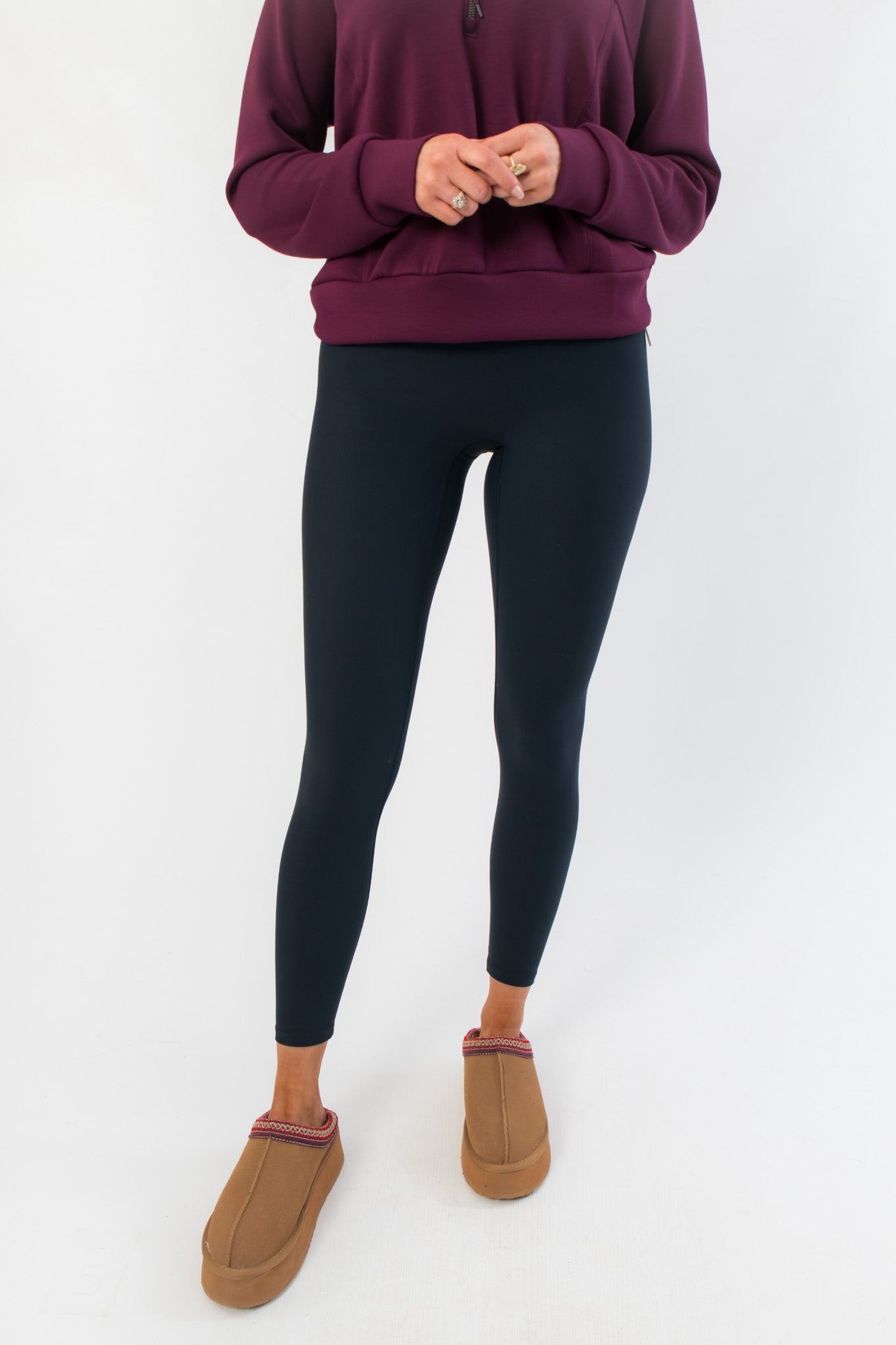 Close-up front view of Spanx Very Black Full Length Leggings showcasing sleek, slimming fit and ankle-length cut for women.