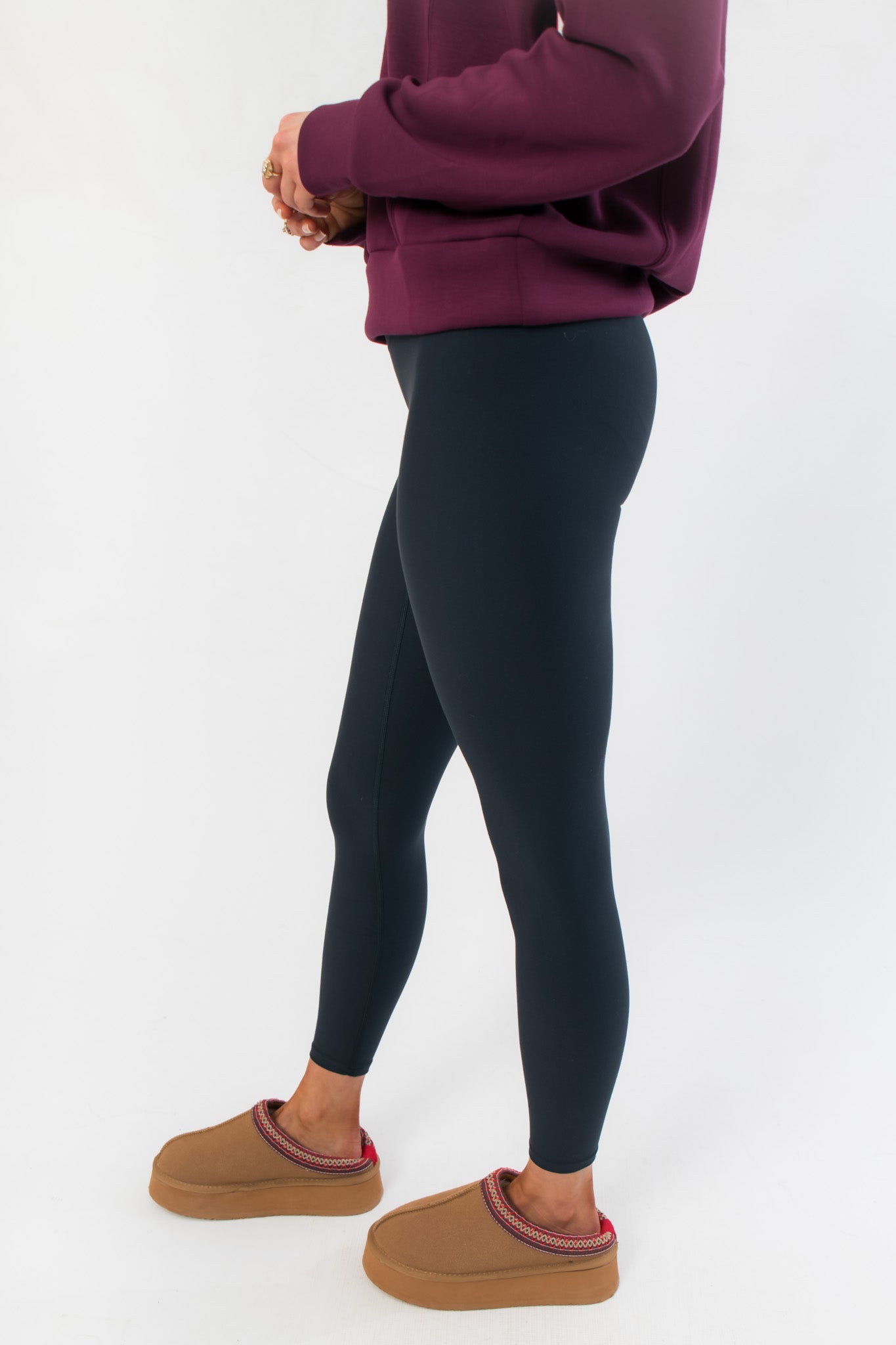Side profile of Spanx Very Black Full Length Leggings highlighting contouring design and smooth silhouette for everyday comfort.