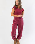 Winterberry Elastic Waist Jogger Sweatpants in berry red styled with matching crop top, featuring relaxed fit and ankle cuffs for cozy loungewear.