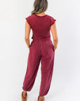 Back view of Winterberry Elastic Waist Jogger Sweatpants showing elastic waistband and loose fit, paired with matching berry red crop top.