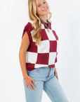 Side angle of Checkmate Burgundy Sweater Vest highlighting its sleeveless cut and burgundy checkerboard pattern, perfect for layering in fall.