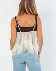 Back view of Free People Ivory Sweet Escape Cami showing sheer tulle layers and contrast straps, ideal for bridal or neutral-toned outfits.