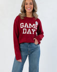 Game Day Garnet Knit Sweater with bold white block letters, oversized fit, and long sleeves, styled for fall football season.