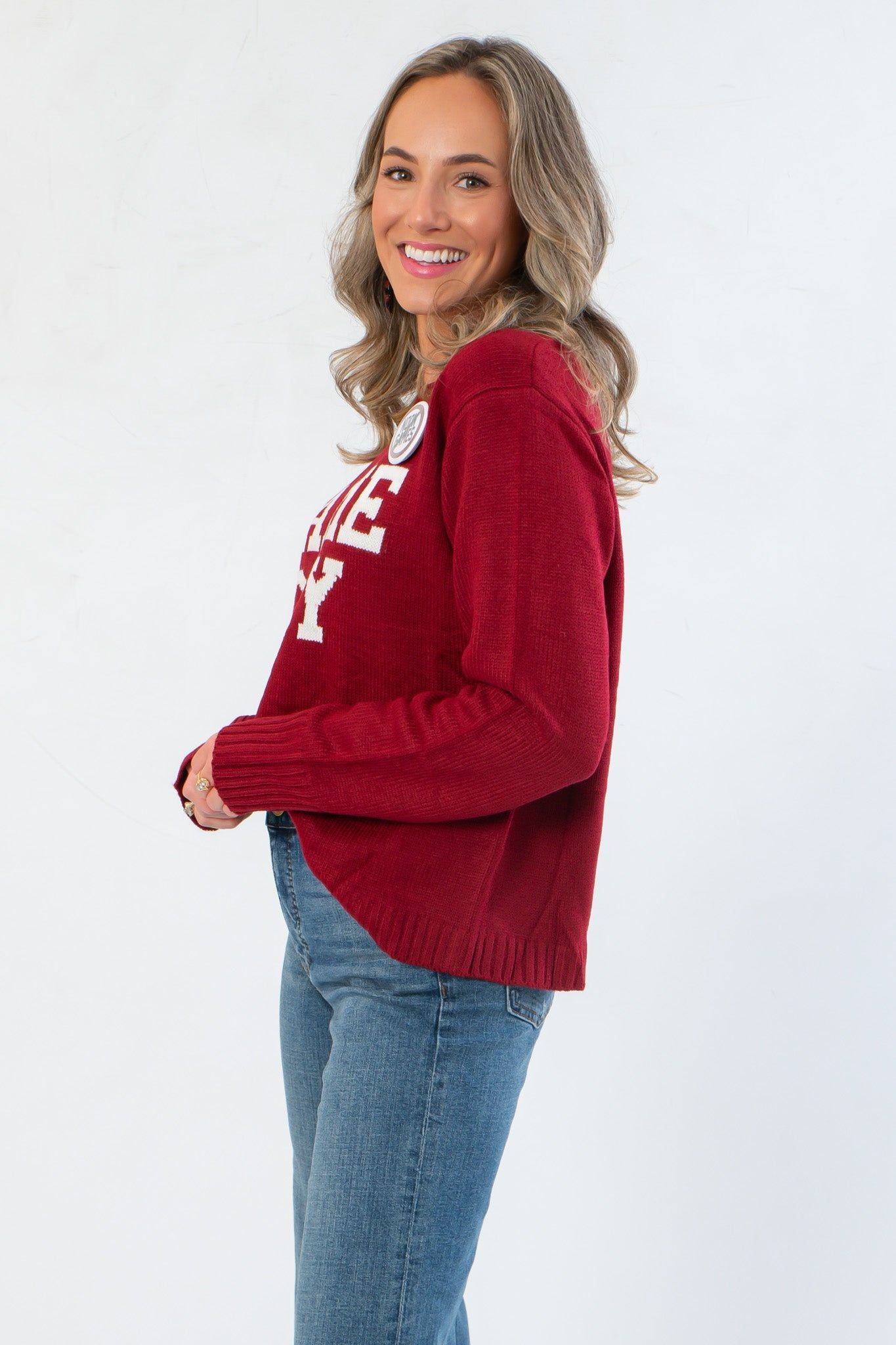 Side view of Game Day Garnet Knit Sweater highlighting relaxed fit, ribbed hem, and soft knit texture ideal for layering.