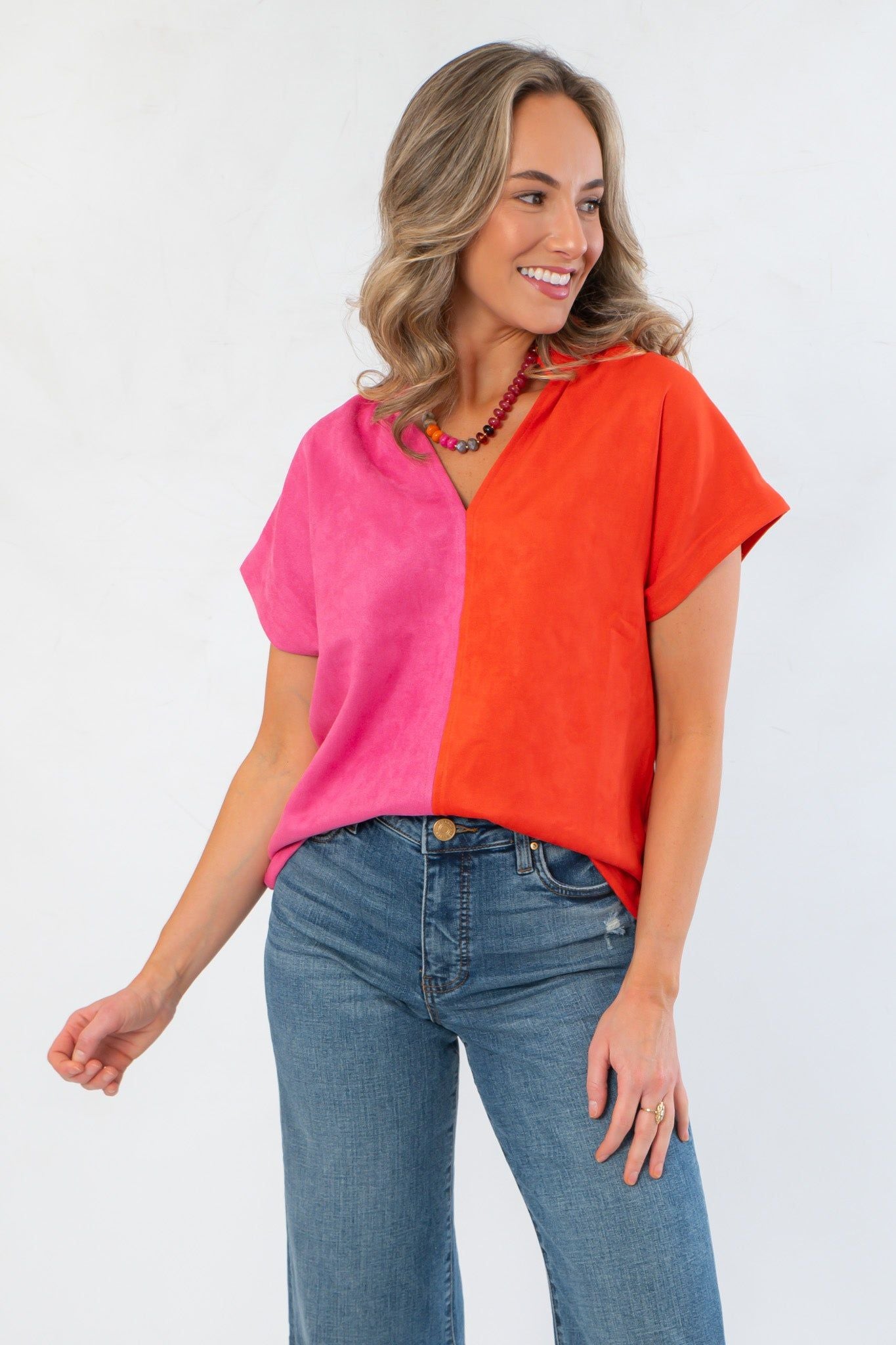 Front view of THML Orange & Pink Colorblock Suede Top featuring a bold split-tone design and relaxed fit for seasonal style.