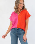Front view of THML Orange & Pink Colorblock Suede Top featuring a bold split-tone design and relaxed fit for seasonal style.