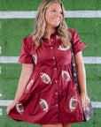 Stand out on game day in the Garnet Sequin Football Dress, a chic short dress with shimmering football sequin details and a flattering tiered design.