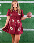 Sporty meets stylish in the Garnet Sequin Football Dress, a trendy shirt dress with sequin football accents, ideal for football fans and gameday outfits.