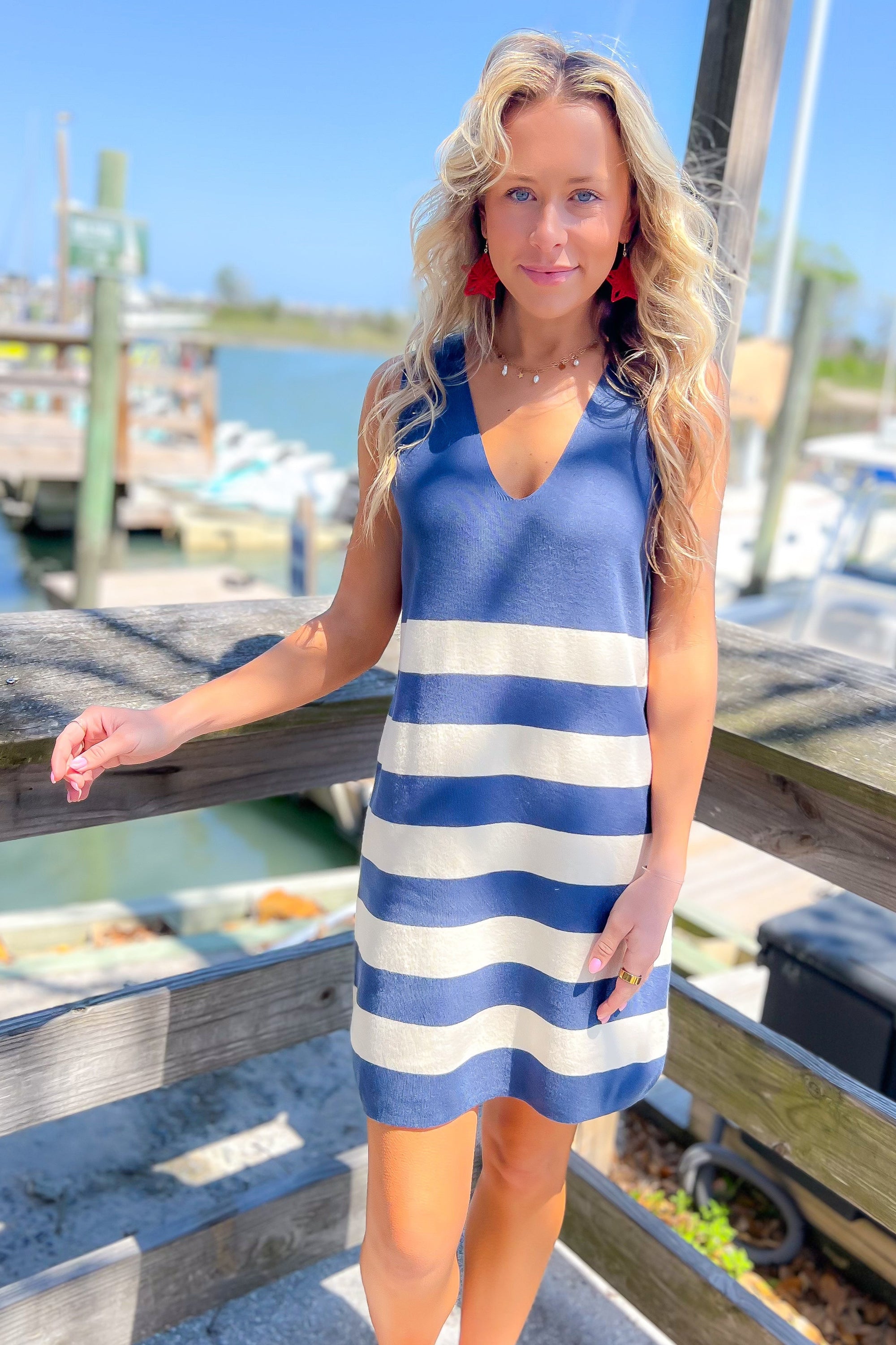 Navy & White Striped Knit Midi Sweater Dress with V-neckline, perfect for nautical summer style by the harbor.