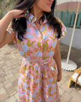 Close-up of Coral Gables Floral Midi Shirt Dress showing collared neckline, button-front detail, and vibrant pink and blue floral pattern.