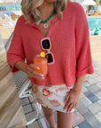 Papaya Short Sleeve Crop Sweater | Lightweight Cropped Knit styled with a beach-themed mini skirt and drink by the poolside for summer fashion.