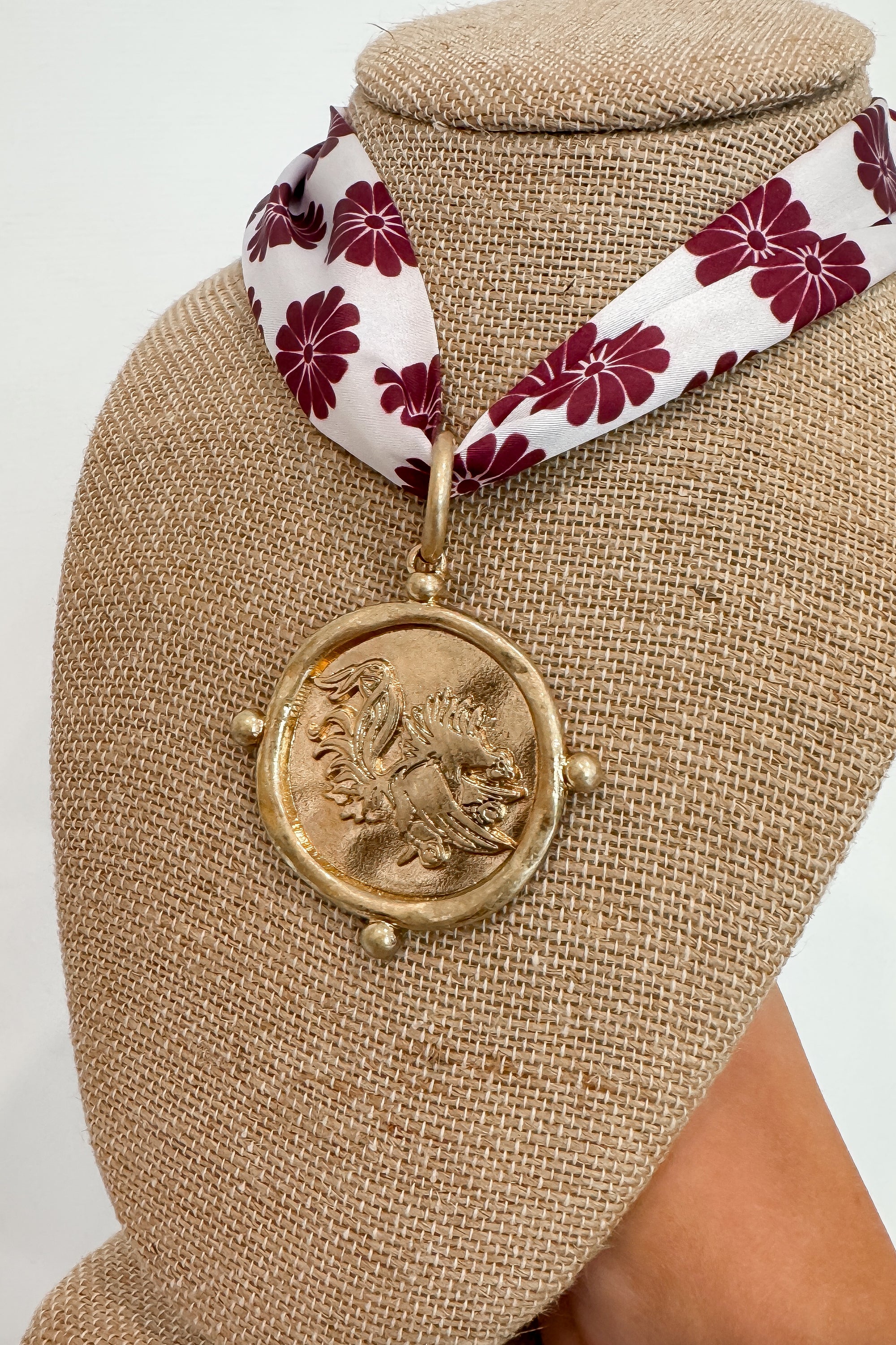 Close-up of Garnet USC Gamecock Serafina Scarf Necklace showcasing detailed Gamecock medallion and garnet floral scarf, ideal for USC gameday style.