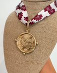 Close-up of Garnet USC Gamecock Serafina Scarf Necklace showcasing detailed Gamecock medallion and garnet floral scarf, ideal for USC gameday style.