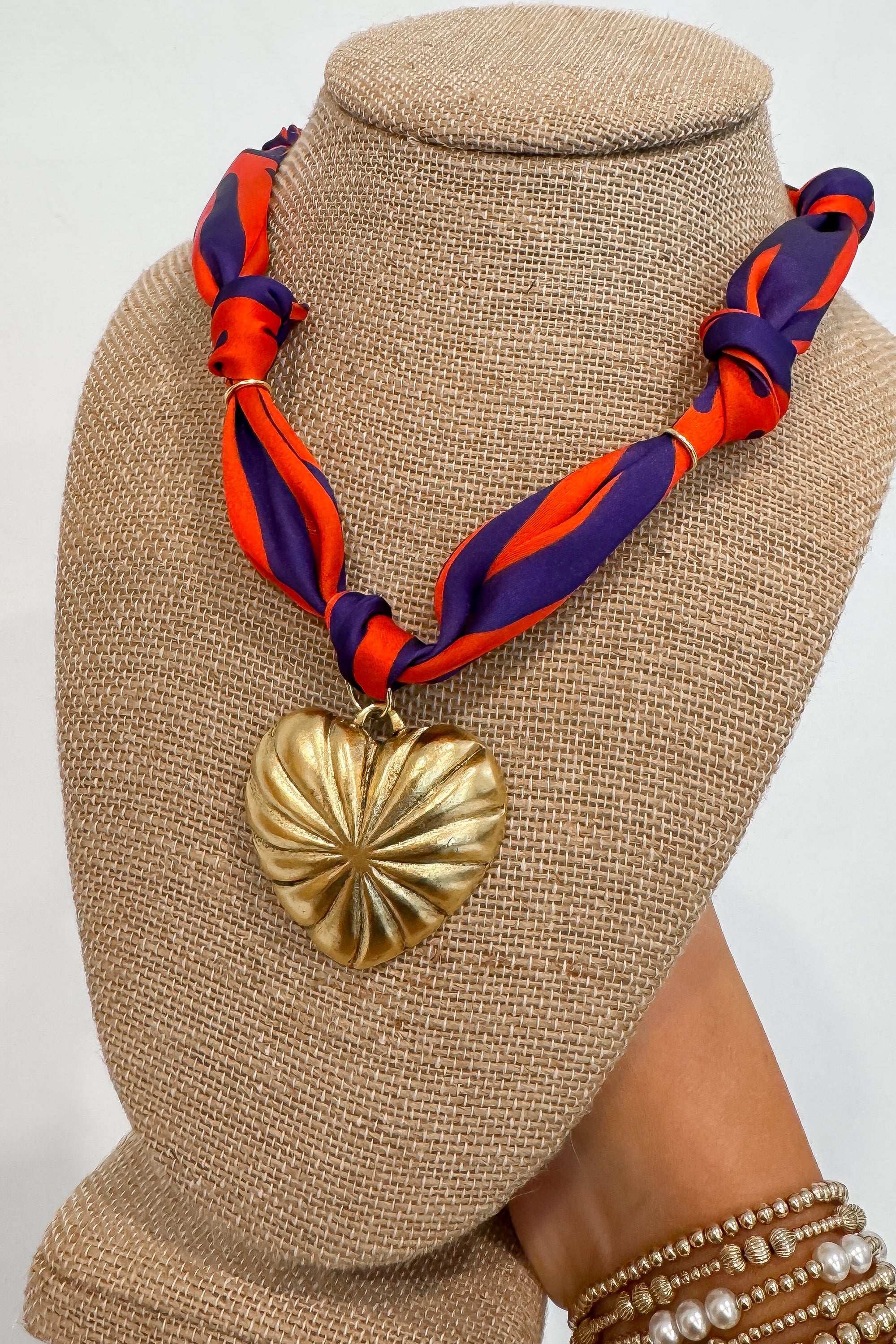 Tiger Stripe Bandana Heart Necklace featuring vibrant orange and purple scarf with gold heart pendant, trendy Clemson-inspired accessory.