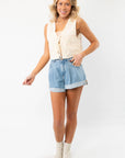 Model wearing the Jolene Beige Embroidered Tie Top Vest paired with denim shorts and ankle boots, showcasing a chic boho-inspired summer look.