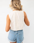 Back view of the Jolene Beige Embroidered Tie Top Vest, showcasing its solid beige fabric and cropped cut, ideal for layering over casual outfits.