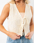 Jolene Beige Embroidered Tie Top Vest with intricate embroidery and ribbon ties, exuding effortless coastal boho vibes. Perfect for layering over summer outfits.