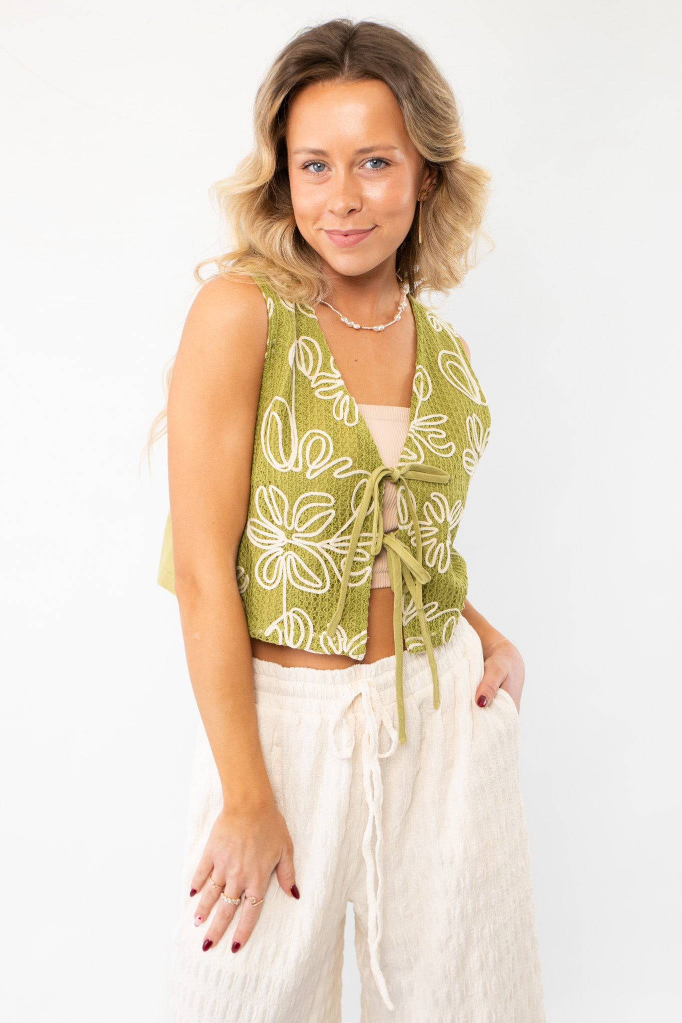 Jolene Matcha Embroidered Tie Top Vest featuring delicate embroidery and a front tie closure, adding a boho-chic touch to any summer wardrobe.