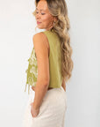 Side view of the Jolene Matcha Embroidered Tie Top Vest highlighting its sleeveless cut and lightweight fabric. A stylish and breathable vest for warm days.
