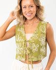 Jolene Matcha Embroidered Tie Top Vest with floral embroidery and ribbon ties, exuding effortless coastal boho vibes. A stylish sleeveless vest for summer.