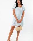 Callie Square Neck Blue Stripe Mini Dress - Summer Essential styled with nude wedges and straw handbag, perfect for casual warm-weather outings.