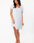 Callie Square Neck Blue Stripe Mini Dress in a flowy silhouette with subtle vertical stripes, great for casual daywear or vacation style.