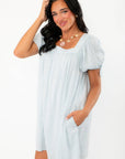 Callie Square Neck Blue Stripe Mini Dress with short puff sleeves and side pockets, combining comfort and effortless summer fashion.