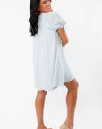 Back view of Callie Square Neck Blue Stripe Mini Dress showing its airy fit and lightweight fabric, perfect for summer comfort and style.