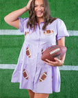 Model holding football in Lavender Sequin Football Dress - Trendsetting Gameday Style with glittery football patches and flared silhouette for sporty flair.