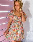 MINKPINK Lorelei Hibiscus Flower Ruched Mini Dress featuring a vibrant floral print, puff sleeves, and a flattering smocked back panel for summer style.