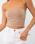 Mocha double-layered tube top with a snug fit, styled with white high-waisted jeans. Perfect for casual and lounge wear.