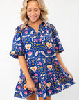Morgan Folk Love Mini Dress featuring a vibrant folk-inspired pattern, puff sleeves, and a ruffle hem. A playful and effortless casual dress.