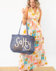 Resort-ready Moroccan Coast Tile Print V-Neck Maxi Dress styled with a woven beach bag, perfect for summer vacations and breezy coastal outings.