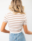Back view of the Next Up Taupe Striped Knit Crop Top, featuring horizontal taupe and white stripes and a fitted silhouette for a chic casual style.