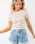 Next Up Taupe Striped Knit Crop Top with short sleeves and a crew neckline, paired with high-waisted denim shorts for a casual summer look.