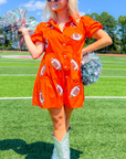 Cheer in style with the Orange Sequin Football Dress, a short-sleeve mini dress with playful football sequin accents, perfect for gameday.