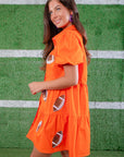 The Orange Sequin Football Dress combines sporty and chic with puff sleeves, a button-up front, and shimmering football sequin details.