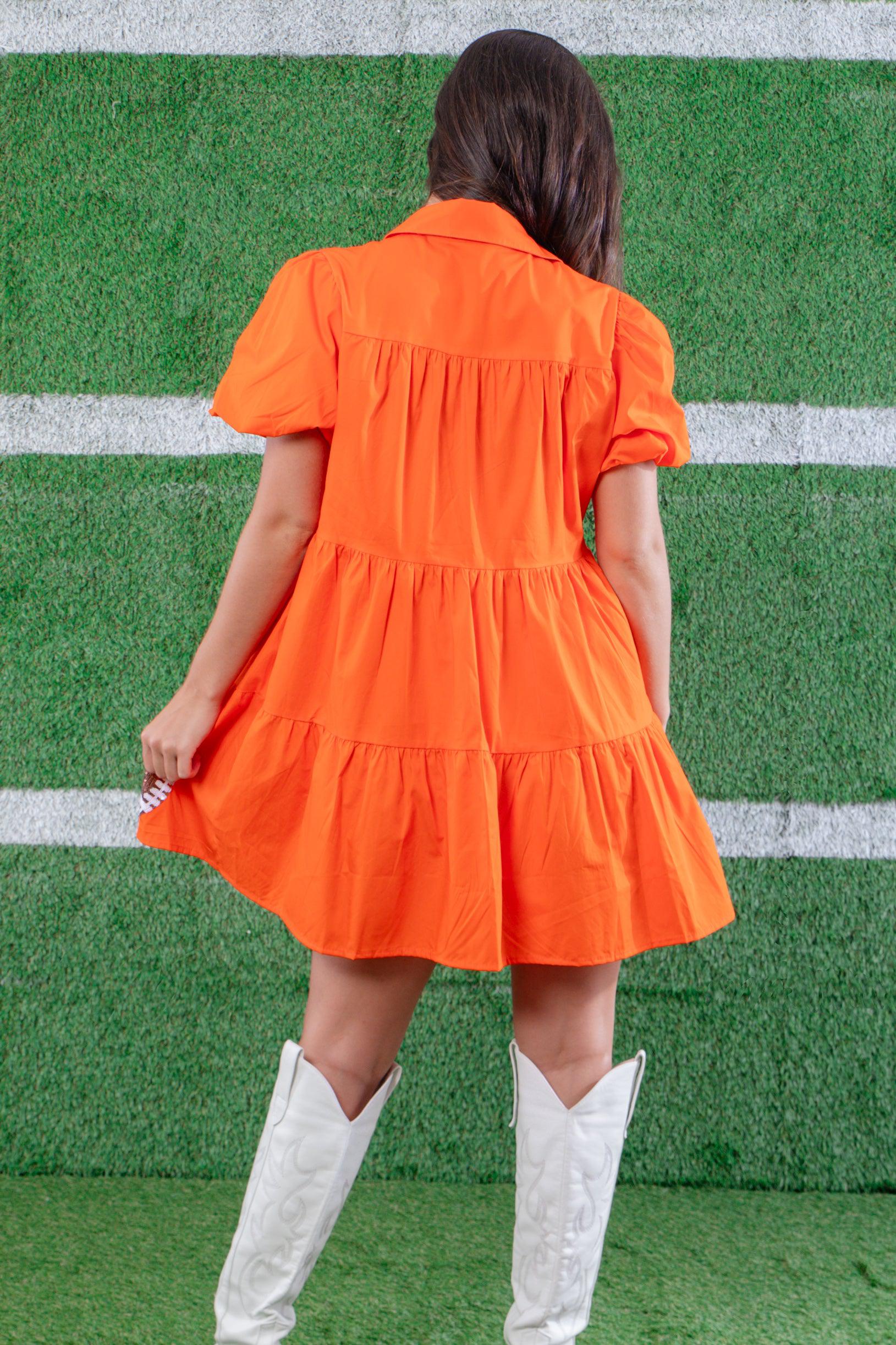 Back view of the Orange Sequin Football Dress, showcasing its tiered design, puff sleeves, and comfortable fit for a stylish game day look.