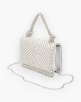 Side view of the pearl studded rhinestone handle clutch bag, showcasing its detachable chain strap and shimmering embellishments for versatile styling.