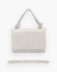 Front view of the pearl studded rhinestone handle clutch bag with a detachable chain strap, highlighting its intricate beaded design and structured silhouette.