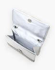 Interior view of the pearl studded rhinestone handle clutch bag, displaying its spacious compartments and snap closure for secure storage.