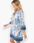 Side profile of the Priscilla Blue Print Kaftan Dress highlighting its intricate blue patterns and comfortable three-quarter sleeves.