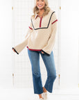 Model wearing a garnet and black Quarter Zip Sweater with contrast piping. A cozy knit sweater ideal for casual outings and cool weather.