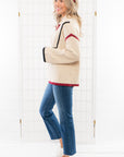 Side profile of the garnet and black Quarter Zip Sweater with contrast piping. A cozy knit sweater with a relaxed fit for effortless style.