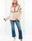 Quarter Zip Sweater in garnet and black with contrast piping. Cozy knit design, perfect for layering on chilly days with a stylish, relaxed fit.
