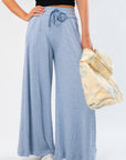 Close-up of Free People Soft Chambray Wide-Leg Lounge Pants featuring soft cotton fabric, wide-leg cut, and relaxed fit for luxe comfort.