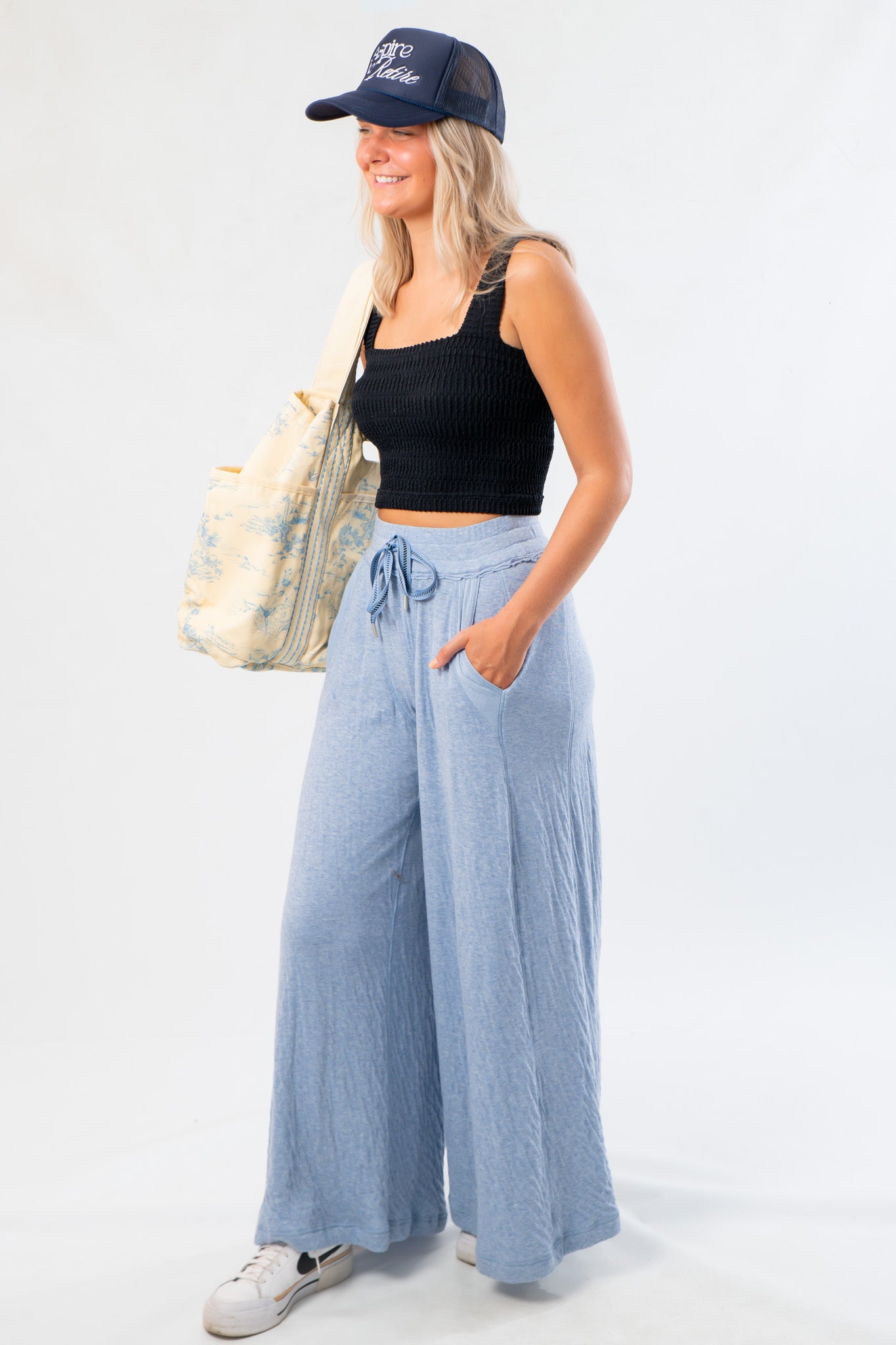 Side view of Free People Soft Chambray Wide-Leg Lounge Pants with flowy silhouette and functional pockets, ideal for stylish lounging.