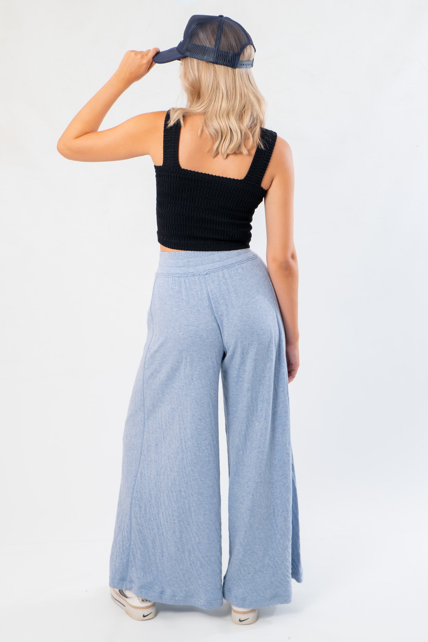 Back view of Free People Soft Chambray Wide-Leg Lounge Pants showing elastic waistband and soft drape, perfect for everyday loungewear.
